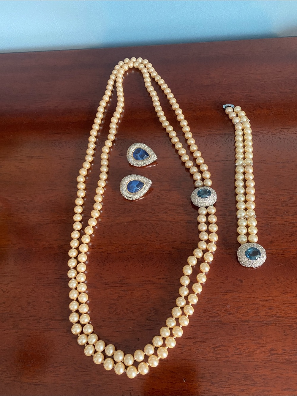 CIRO Elegant Champagne Pearl Set with  Blue Crystal Accents.